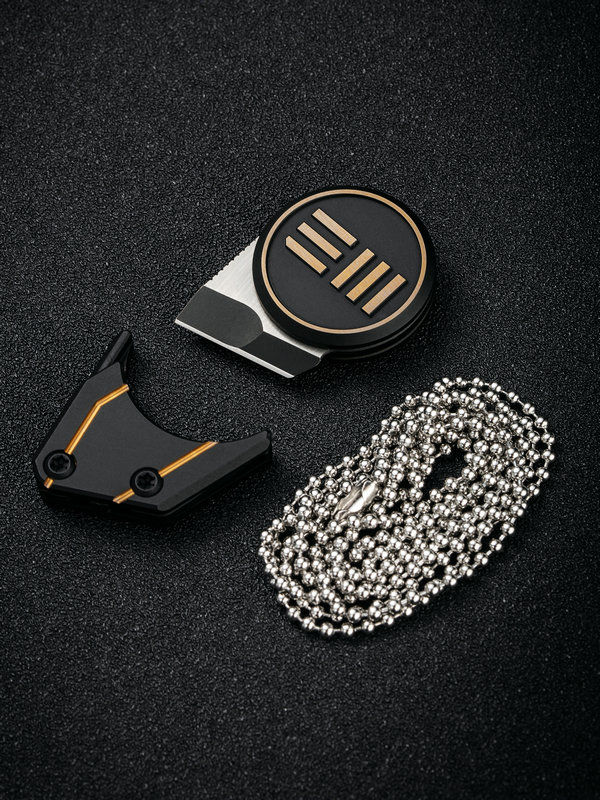 1631886156164260 We Knife Company 20021-1 Ostap Hel Quark Pendant Fixed Neck Knife 0.32" M390 Two-Tone Tanto Blade, Black and Gold Titanium Handles, Magnetic Titanium Sheath - Image 1